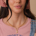 Bubble Letter initial carabiner necklace worn on model