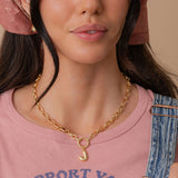 Bubble Letter initial carabiner necklace worn on model