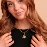 Roux Duo Carabiner Necklace on a model with charms. Charms sold separately