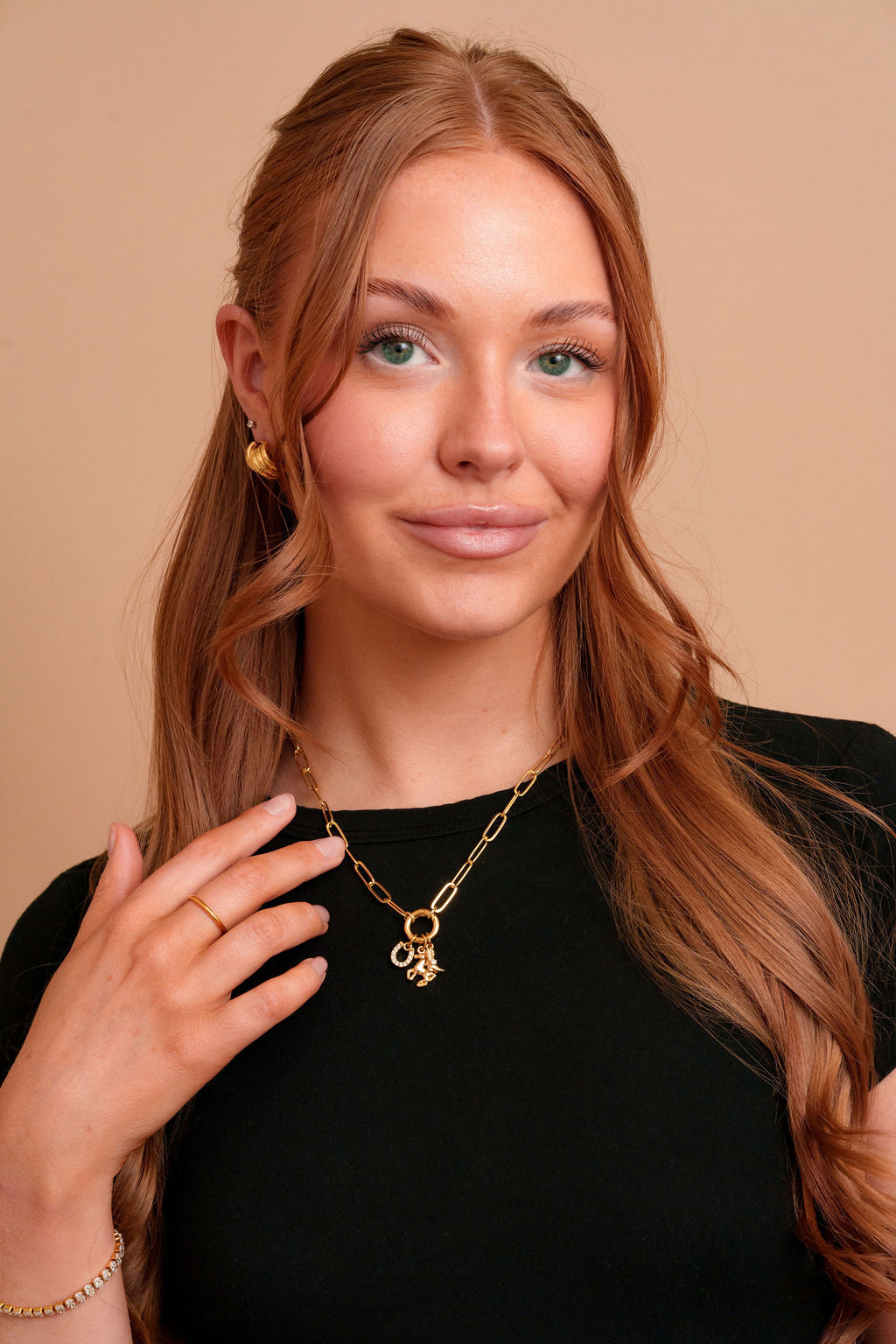 Model wearing the Indie gold filled carabiner necklace by Tikkhu