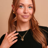 Model wearing the Indie gold filled carabiner necklace by Tikkhu
