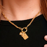 Lennon Carabiner Necklace on a model with charms. Charms sold separately
