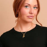 Marlow Mini Carabiner Necklace on a model with charms. Charms sold separately