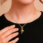 Marlow Mini Carabiner Necklace on a model with charms. Charms sold separately