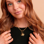 Roux Necklace in gold styled with charms