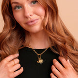 Roux Necklace in gold styled with charms