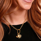 Close-up of the Roux Necklace in gold with charms