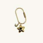 Twinklepuff XL brass monogram carabiner with bubble letter and star by Tikkhu