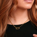 Model wearing the Vada Mini gold filled carabiner necklace by Tikkhu