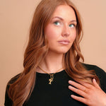 Vada Mini Carabiner Necklace on a model with charms. Charms sold separately