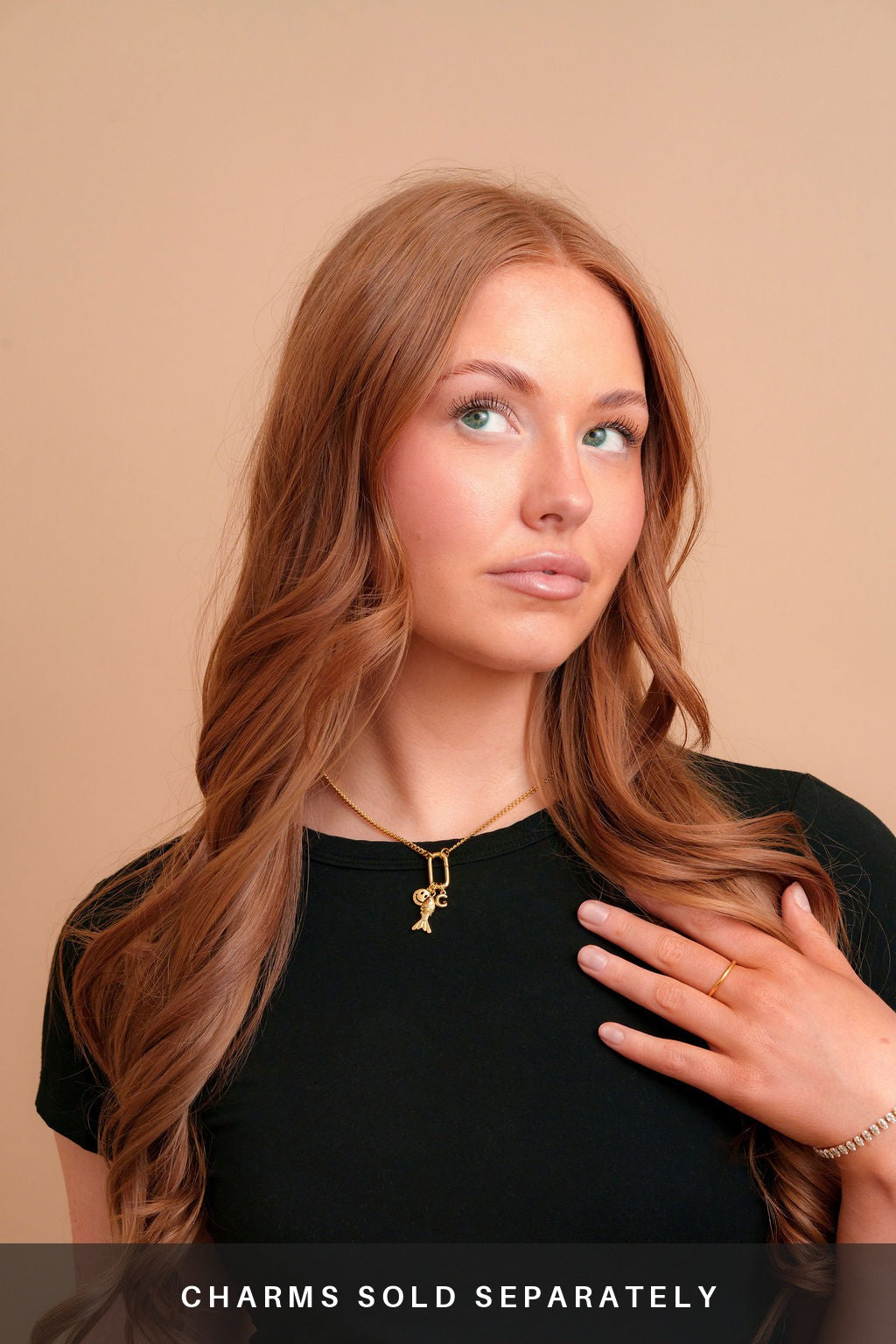 Vada Mini Carabiner Necklace on a model with charms. Charms sold separately