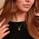 Wren Mini Carabiner Necklace on a model with charms. Charms sold separately